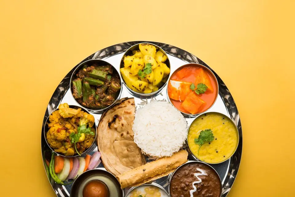 [freepicdownloader.com]-indian-hindu-veg-thali-food-platter-selective-focus-large (1).webp