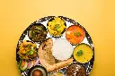 [freepicdownloader.com]-indian-hindu-veg-thali-food-platter-selective-focus-large (1).webp